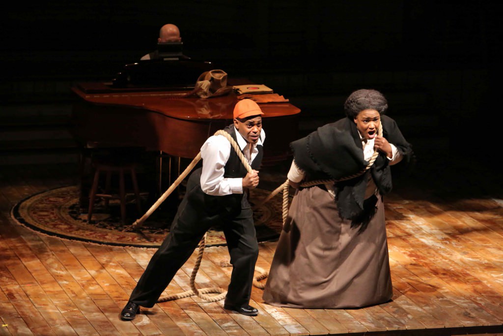 An image of a man and woman actor from Hartford Stage's production of Breath & Imagination