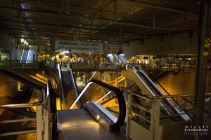 Escalators converge in a Paris Train Station showing a very bare, but industrial and machinery based image of travel.