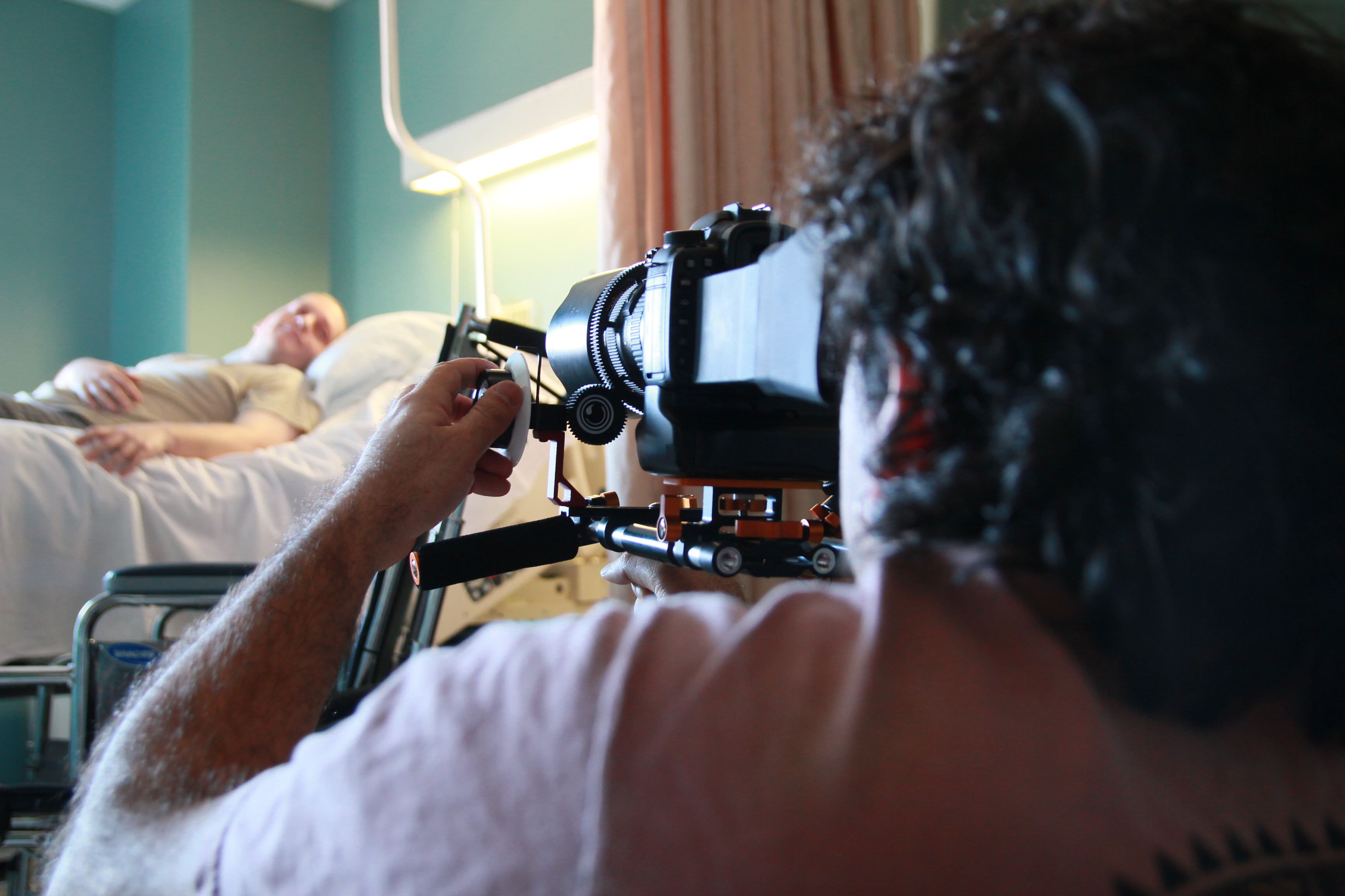 Using Video for Business marketing is essential, Miceli Productions offers video production services like seen in the photo. Photo of Michael Miceli filming a scene in a hospital.