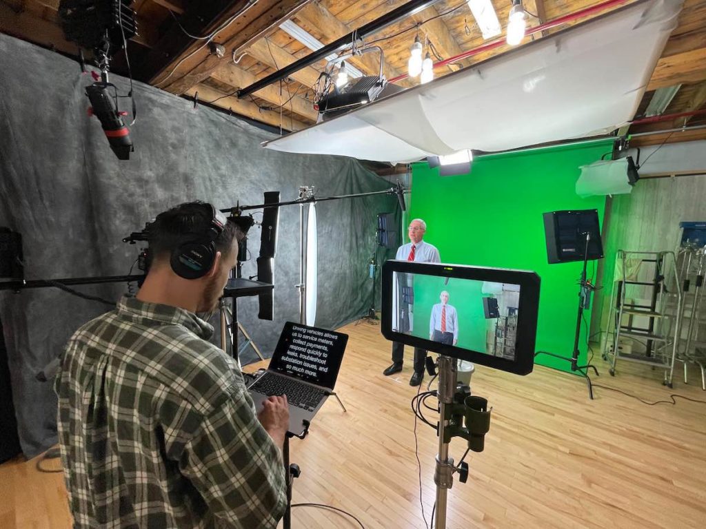 Green screen shoot at Miceli Productions studio to film a talking head video.