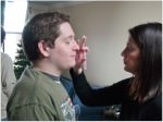 On locaiton make-up being applied to an actor on set.