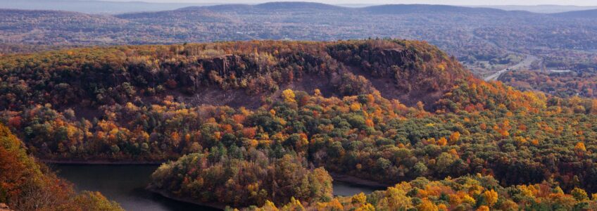 Autumn in New England, Hubbard Park, Meriden CT. A view of fall foliage overlooking water below from Castle Craig.