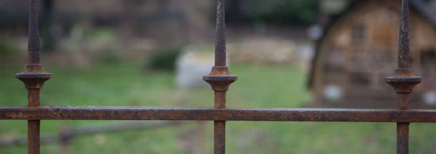 rust, metal fence, cemetery, paris, france, keep out. Photo by Miceli Productions