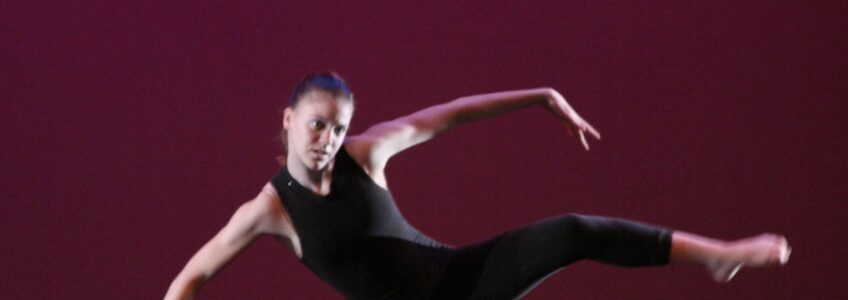 A dancer on stage, in a screen capture image from a video captured by Miceli Productions.