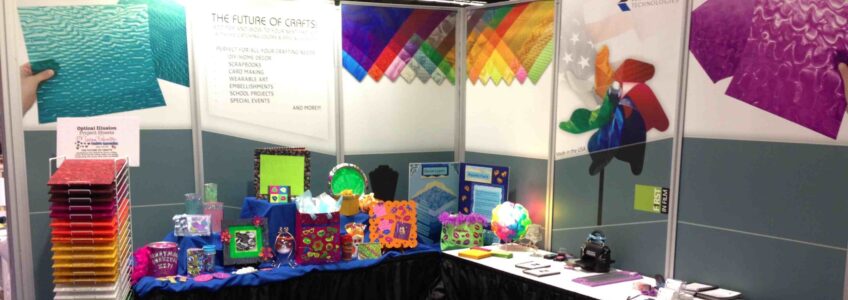 Miceli Productions Photogtraphy displayed in a Rowland Technologies trade show booth {{brizy_dc_image_alt entityId=